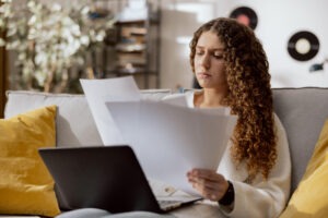 Woman looking at utility bill